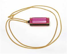 5 hole pink harmonica with a necklace